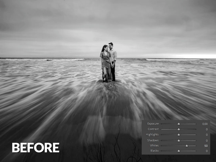 Couple standing in shallow ocean water during overcast conditions, shown before post-processing adjustments.