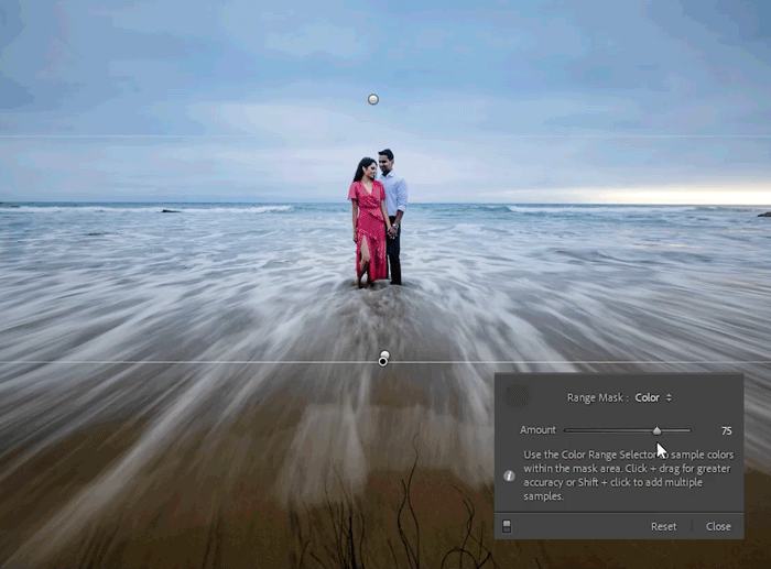 Couple in traditional dress standing in ocean waves with long exposure effect and editing interface visible.