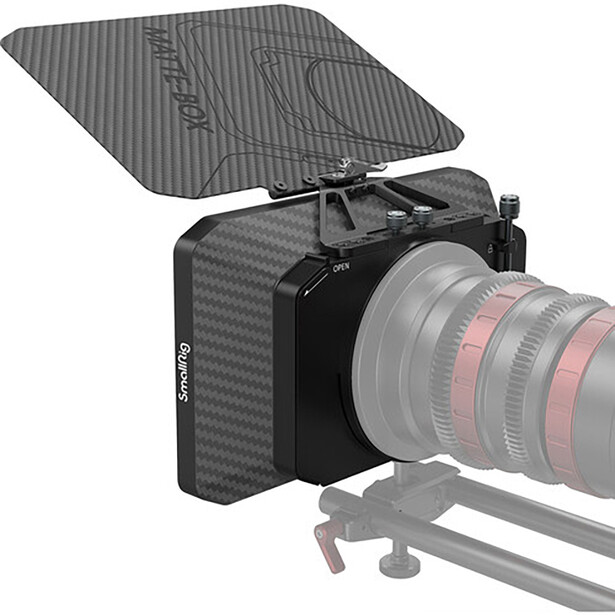 Carbon fiber matte box mounted on cinema camera with telephoto lens assembly on support rig.