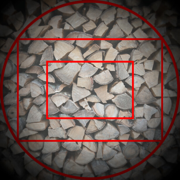 Overhead view of gray stones with three red rectangular frames overlaid, demonstrating compositional framing techniques.