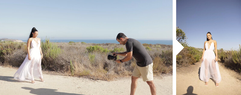 Photographer shooting a woman in a white flowing dress on a sandy coastal trail overlooking the ocean.
