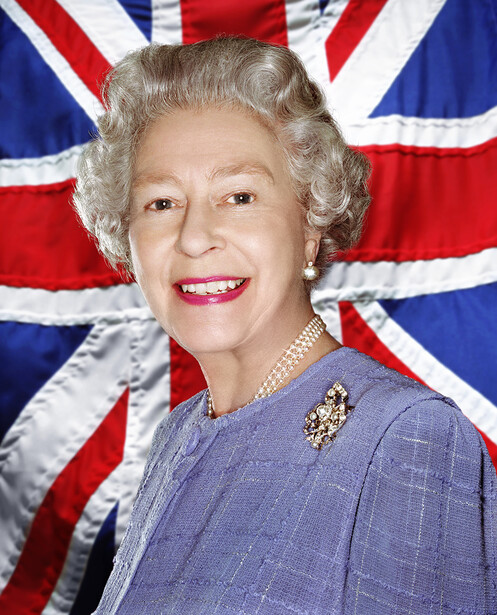Formal portrait of an elderly woman with white hair against a Union Jack background.