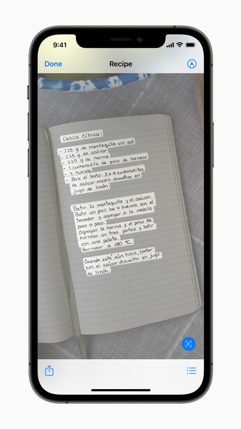 Smartphone displaying the Notes app with a photo of a handwritten document containing multiple paragraphs of text.