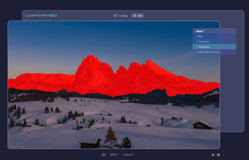 Screenshot of Luminar NEO photo editing interface showing a snowy mountain landscape with red color grading applied to peaks.