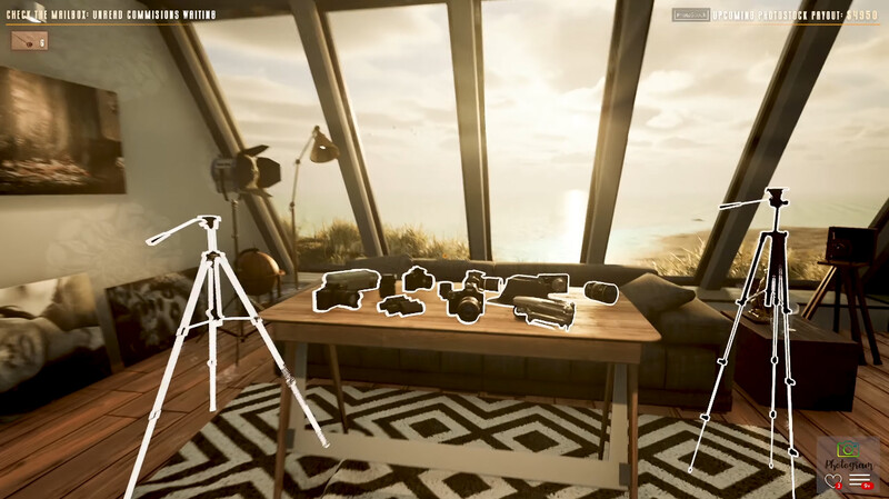 Photography studio setup with tripod-mounted lights flanking a wooden table displaying camera equipment in a bright room with large windows.