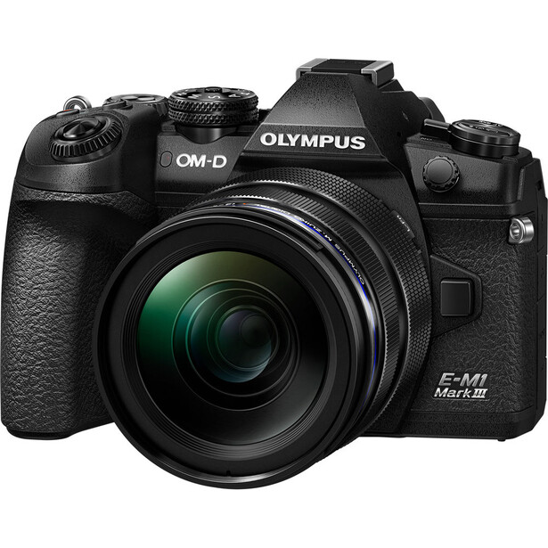 Olympus OM-D E-M1 Mark III mirrorless camera with attached zoom lens on white background.