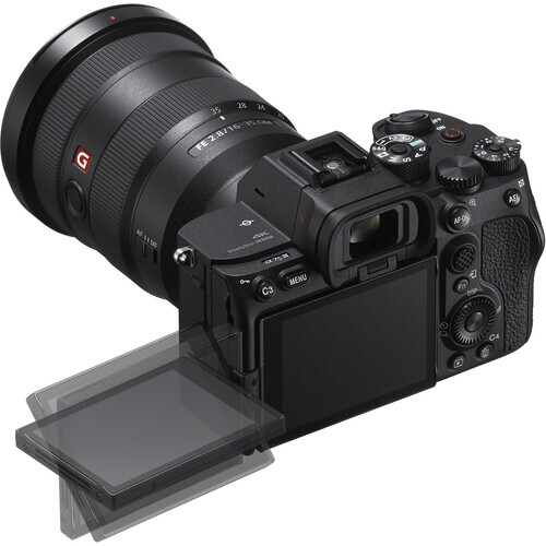 Mirrorless camera with articulating LCD screen and attached wide-angle zoom lens.