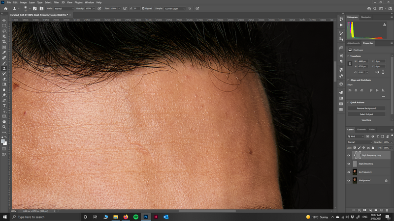 Screenshot of Photoshop with a close-up portrait photo of skin texture and forehead detail open in the editor.