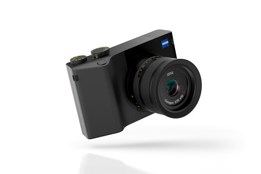 Zeiss compact camera with fixed lens mounted on black body against white background.