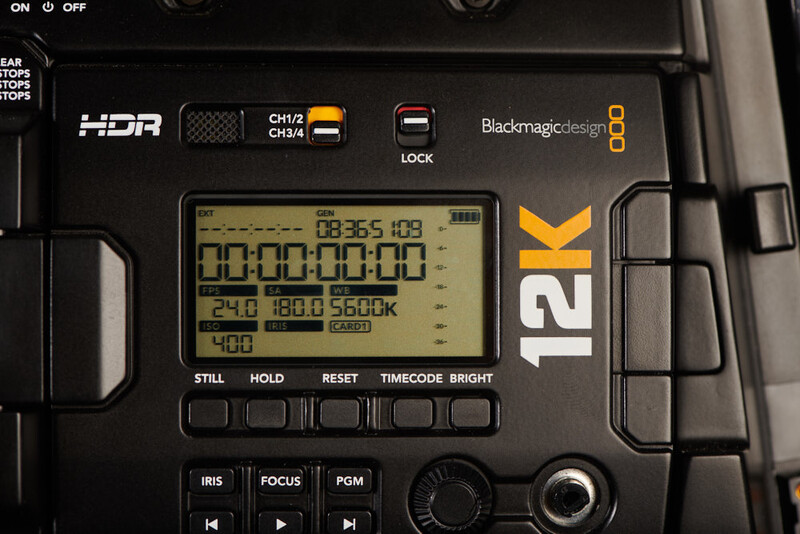 Close-up of Blackmagic Design 12K camera control panel displaying timecode and technical readouts.