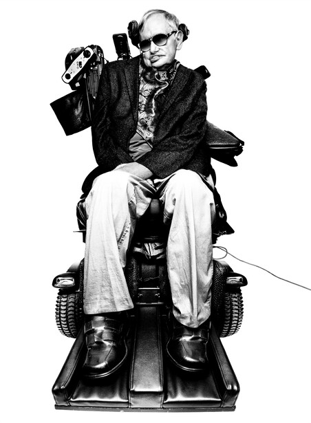 Black and white portrait of an older man in glasses and dark jacket sitting on a motorized scooter.