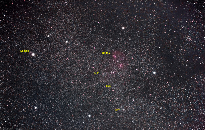 Deep-sky photograph of the Milky Way with labeled nebulae and star clusters against a dense starfield.