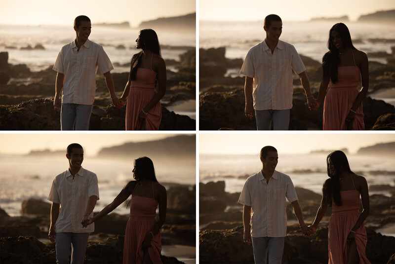 Couple holding hands while standing together overlooking a misty coastal landscape during golden hour.