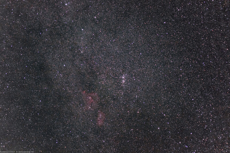 The Milky Way stretches diagonally across a starfield, with purple and pink nebulae visible along the galactic plane.