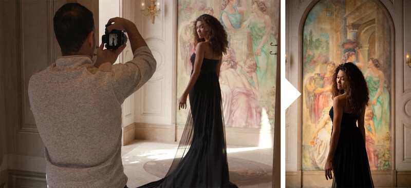 Photographer capturing a portrait of a woman in an elegant black gown against ornate classical interior backdrop.