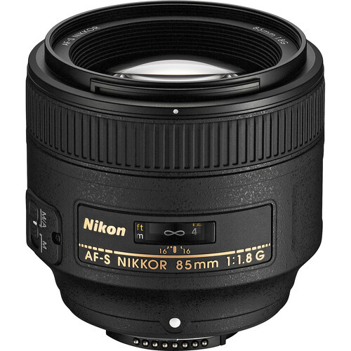 Nikon AF-S Nikkor 85mm f/1.8G prime lens with black barrel and focus ring against white background.