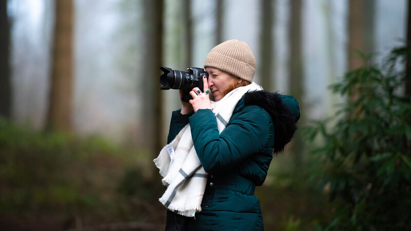 Woman shooting DSLR camera
