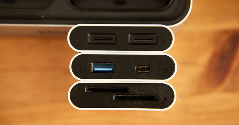 Close-up of device ports showing two USB 2.0 connectors, one USB 3.0 port, one USB-C port, and an SD card slot.