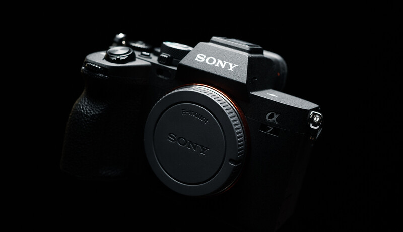 Sony Alpha mirrorless camera body displayed against a black background.