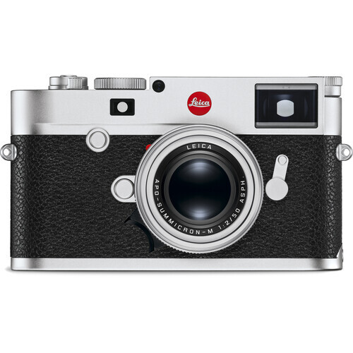 Leica M rangefinder camera with silver top plate and black leather body featuring a fixed lens.