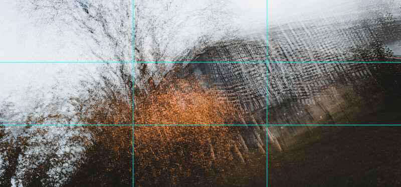 Overhead view of textured surfaces with white frost, rust-colored oxidation, and grid pattern overlay with cyan guide lines.