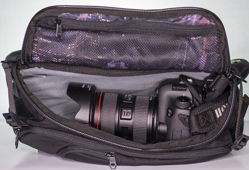 With a fairly ordinary size DSLR (Canon 6D) and professionl lens, there isn't a lot of space in the bag and when you close it, it's a tight fit.