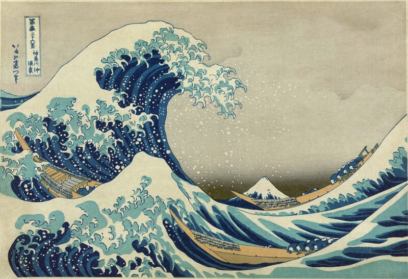Woodblock print depicting a large wave with white foam crashing over smaller waves, with Mount Fuji visible in the distant background.