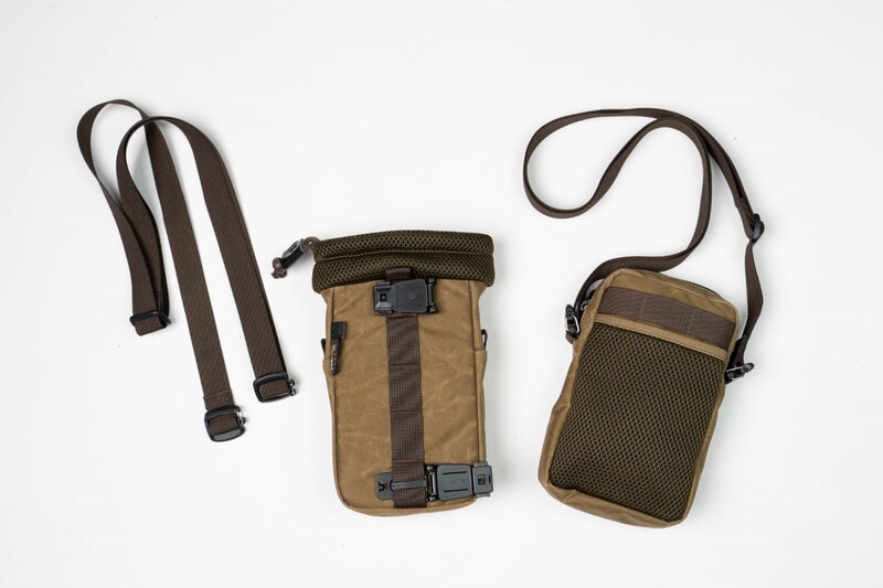 Three tan and brown canvas camera bags with dark straps arranged on white background.