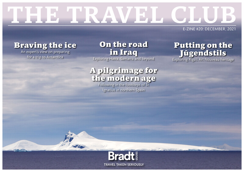 Magazine cover featuring a snow-covered mountain peak against a blue sky with white text overlays.