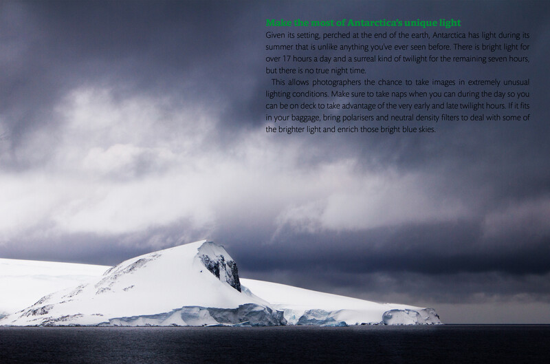 Snow-covered mountain peak rising from dark ocean water beneath dramatic storm clouds.