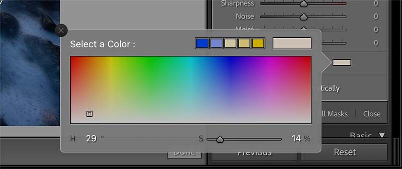 Screenshot of color picker dialog in photo editing software with gradient spectrum and HSL sliders.