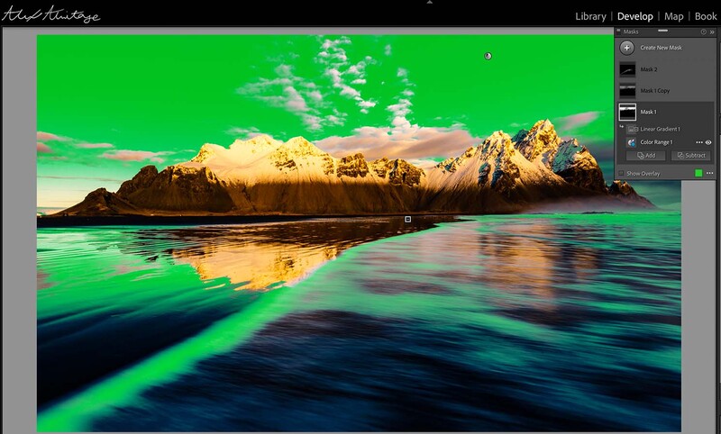 Screenshot of photo editing software displaying a landscape with vibrant green sky, snow-capped mountains, and reflective turquoise water.