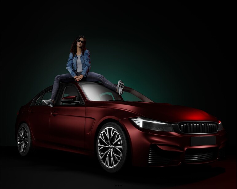 Woman in casual outfit sitting on roof of burgundy sedan against dark green background.