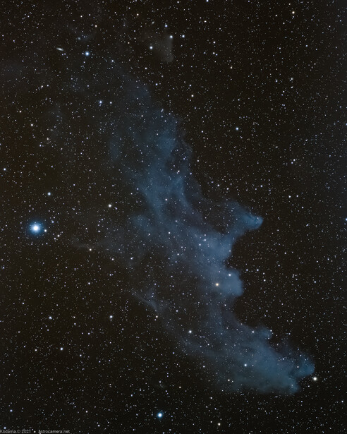 Reflection nebula with bright blue illumination against a dark starfield.