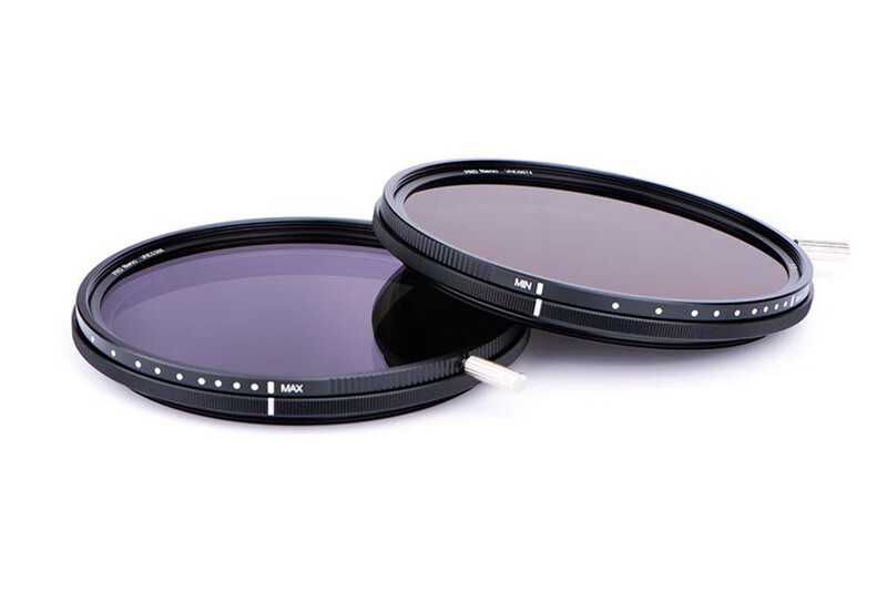 Two variable neutral density filters with threaded metal rings and graduated gray glass elements.