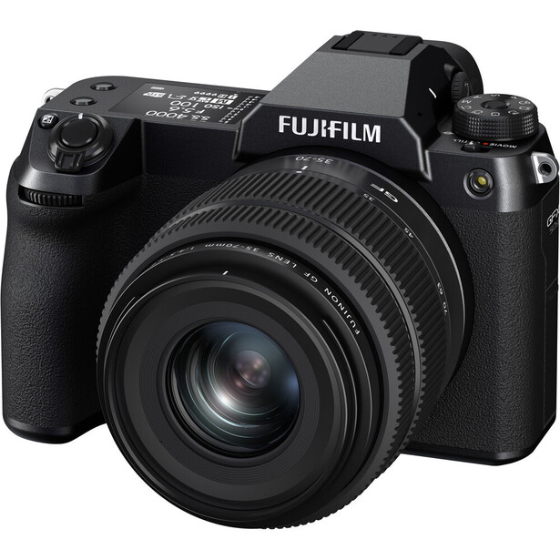 Fujifilm GFX mirrorless camera with attached prime lens on white background.