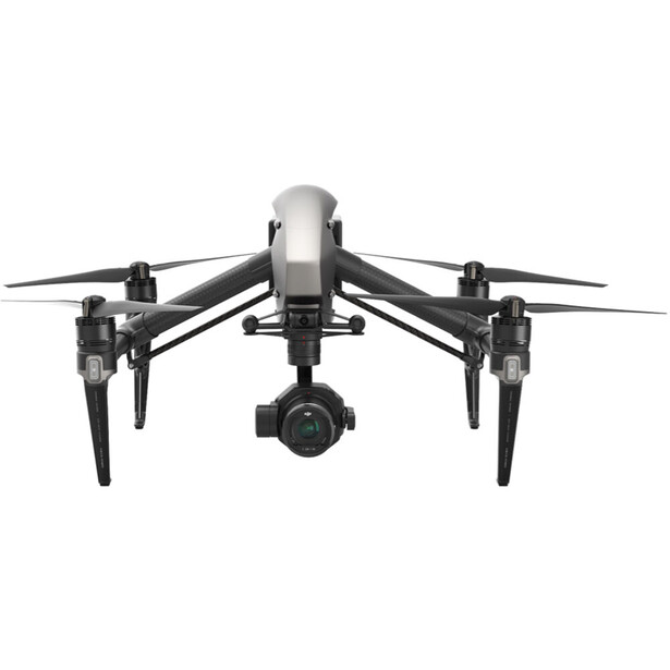 Professional drone with four propellers and gimbal-mounted camera, photographed from above against white background.