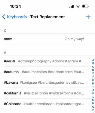 Screenshot of iOS Text Replacement settings showing photography-related hashtag shortcuts.