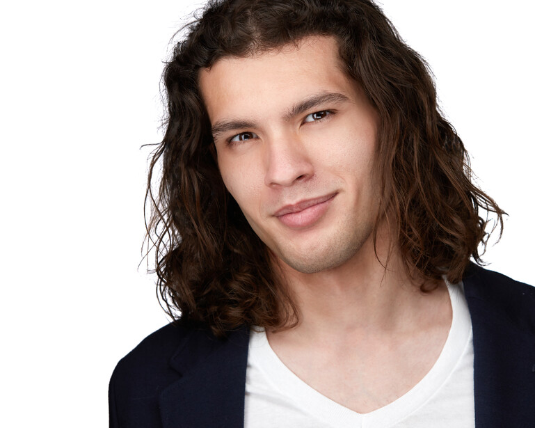 A headshot of actor and model, Tyler.
