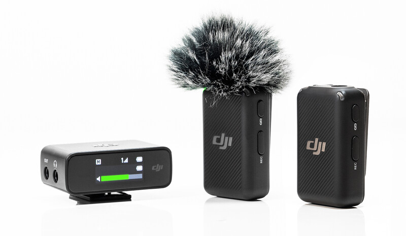 DJI Mic wireless microphone system with receiver and two transmitter units displayed against white background.