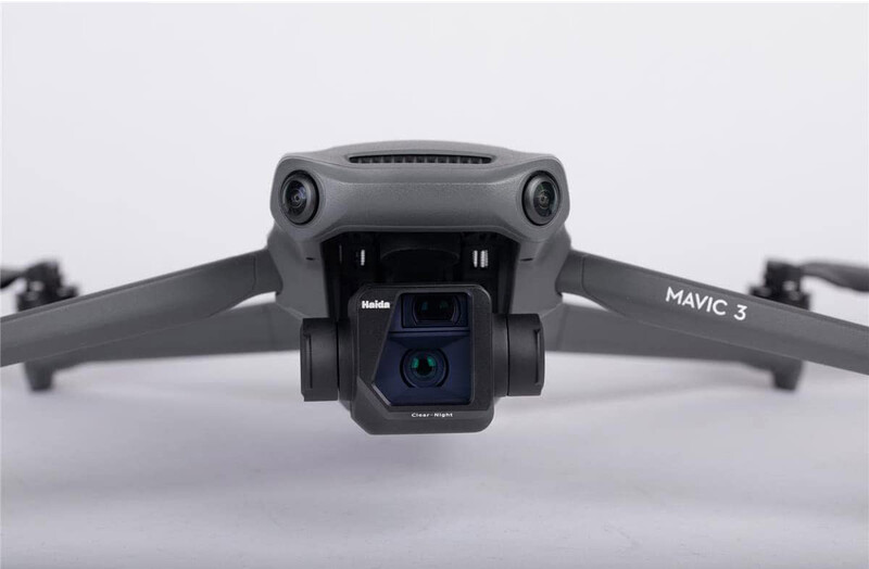 DJI Mavic 3 drone shown from above against a neutral gray background, displaying its dual camera system and folded arms.