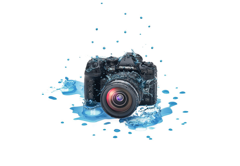 Professional camera surrounded by splashing water droplets against white background.