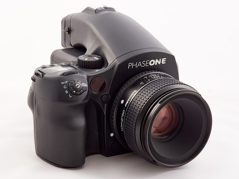 Phase One medium format digital camera with mounted lens, displayed against white background.