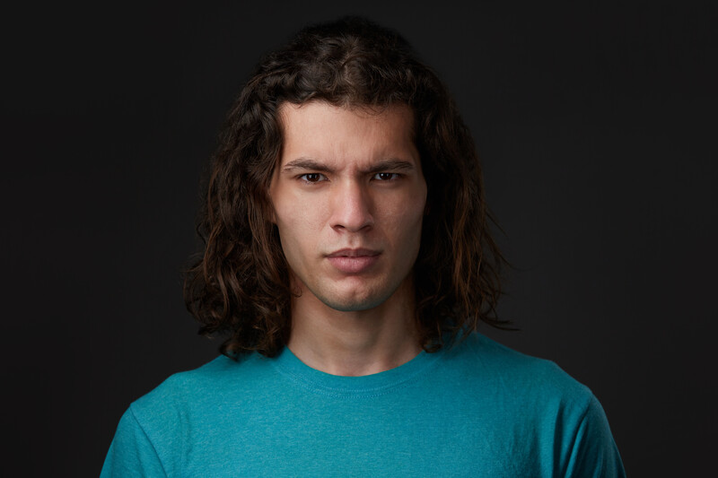 A headshot of actor Tyler