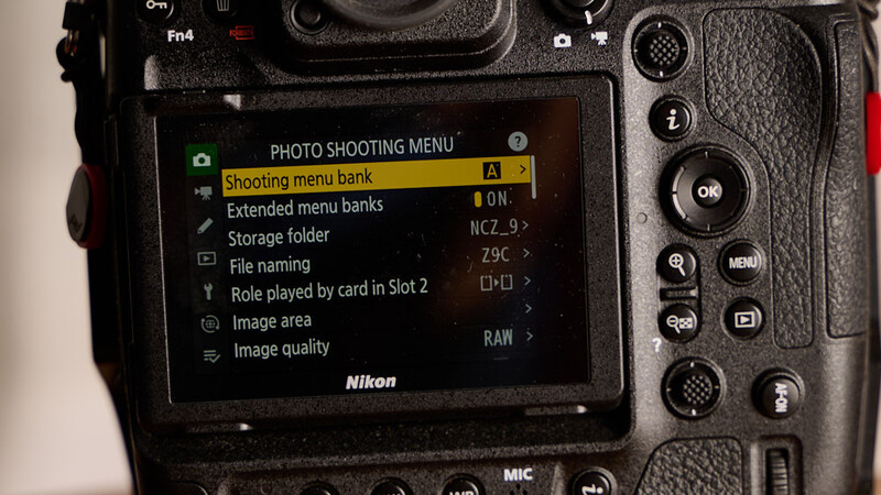 Screenshot of Nikon camera's Photo Shooting Menu with Shooting Menu Bank option highlighted.