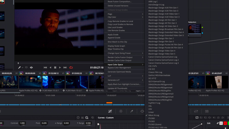 Screenshot of video editing software with color grading interface and timeline showing footage of a person.