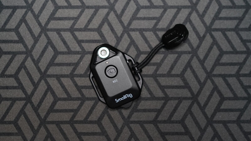 Snoring wireless remote control with microphone attachment on geometric patterned background.