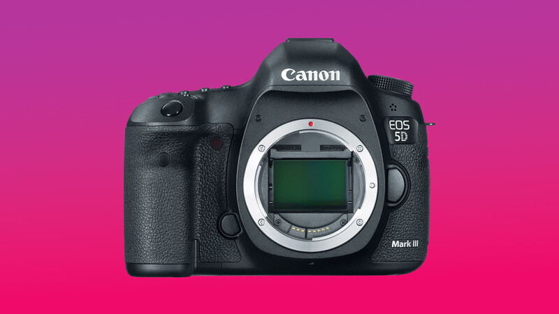 Canon EOS 5D Mark III DSLR camera body with lens mount visible against magenta background.