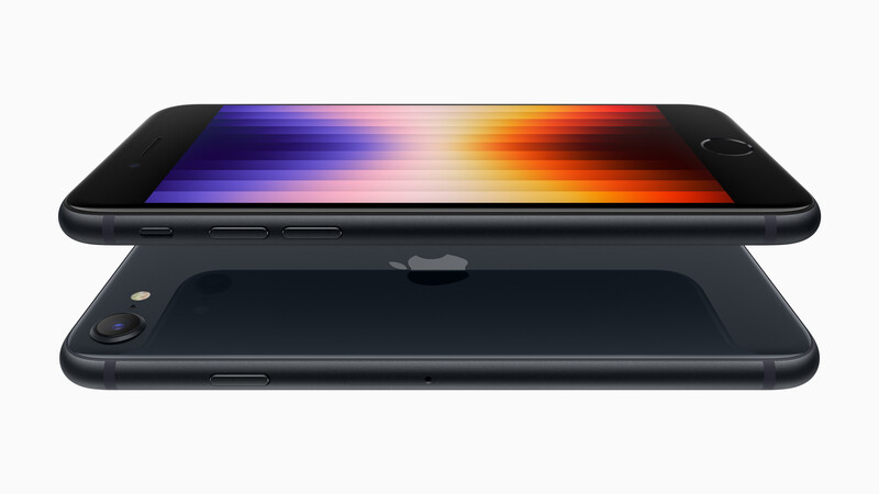 Exploded view of a black smartphone showing the display panel separated from the body, with a gradient rainbow spectrum displayed on the screen.