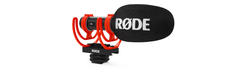 RODE Wireless GO II microphone mounted on a camera hot shoe with red shock mount and windscreen.